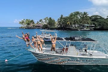Group Of People Jumping Off A Boat Into The Water