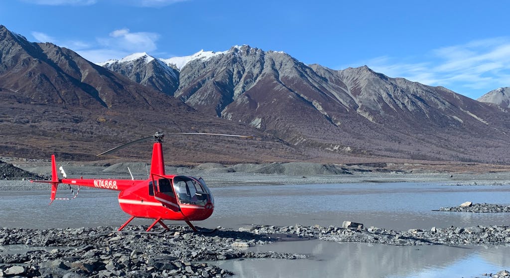 a plane sitting on top of a mountain