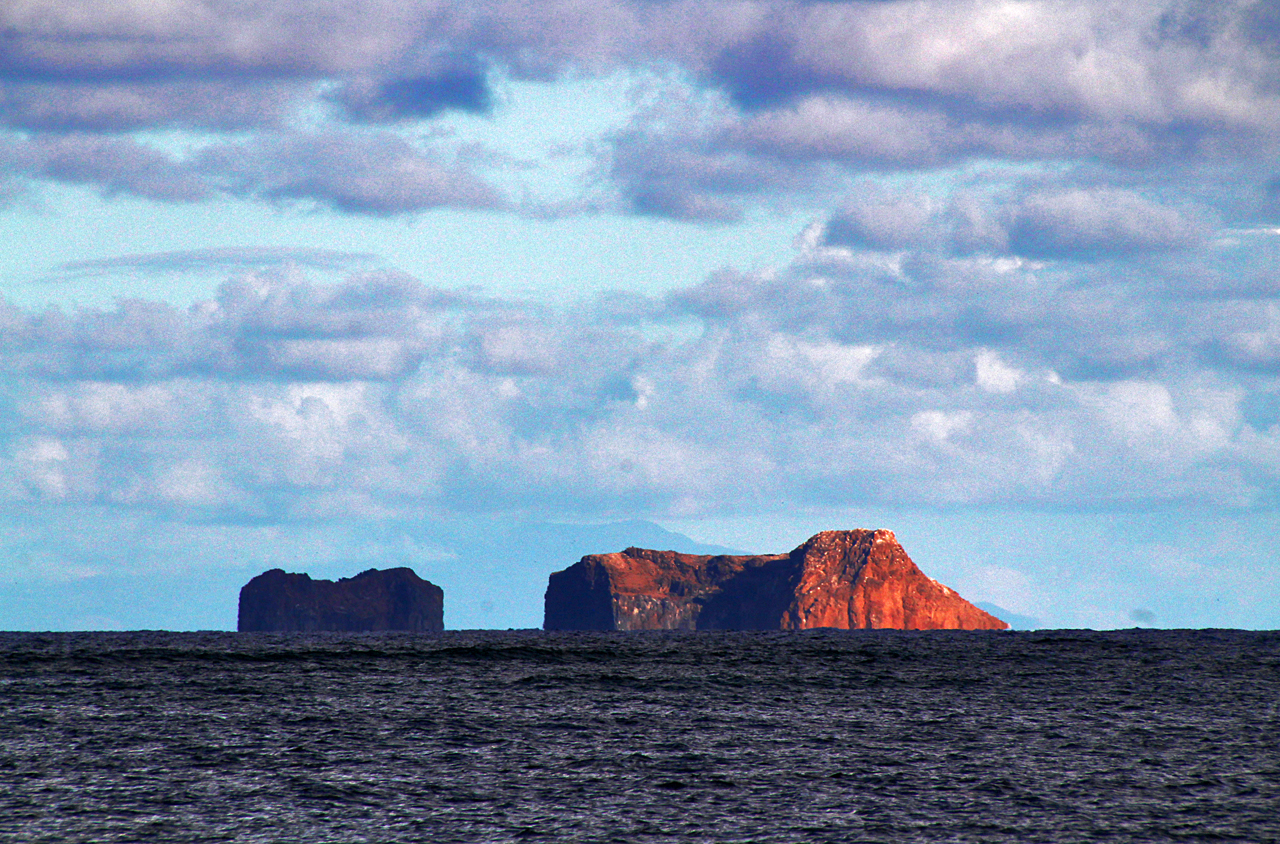 These islands, viewed from Kualoa Ranch, just off of Mokapu penninsula, resemble a mother and baby elephant walking through the water. Moku Manu, or "Bird Island" in the Hawaiian language, is an offshore islet of Oahu, three-quarters of a mile off Mokapu Peninsula. Moku Manu and an adjacent small islet are connected by an underwater dike. The island was formed from debris flung from a vent of the nearby Kailua Volcano. Its highest point is 202 feet (62 m) high, bordered by near-vertical cliffs on many sides. Moku Manu is protected as a state seabird sanctuary. Regardless, landing by boat is nearly impossible due to the lack of a safe beach. Moku Manu's isolated nature makes it an excellent nesting site. Eleven species of seabirds nest on Moku Manu, along with several migrating shorebirds.