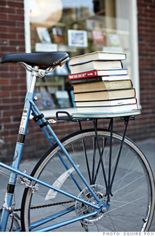 a bicycle parked on the side of a building