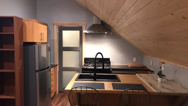 a kitchen with a table in a room