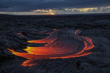 Lava foreground supplemented with a sunrise background