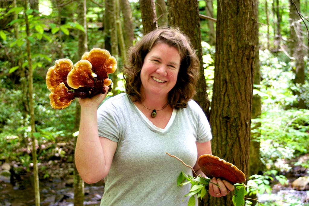 woman holding fungi